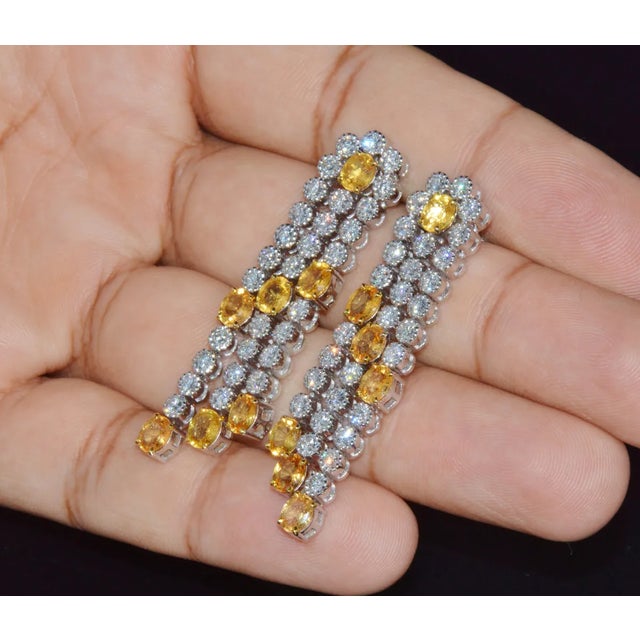 Gorgeous 18K solid gold 8.96CTS diamond and yellow sapphire chandelier earrings. These tiered chandelier earrings are...