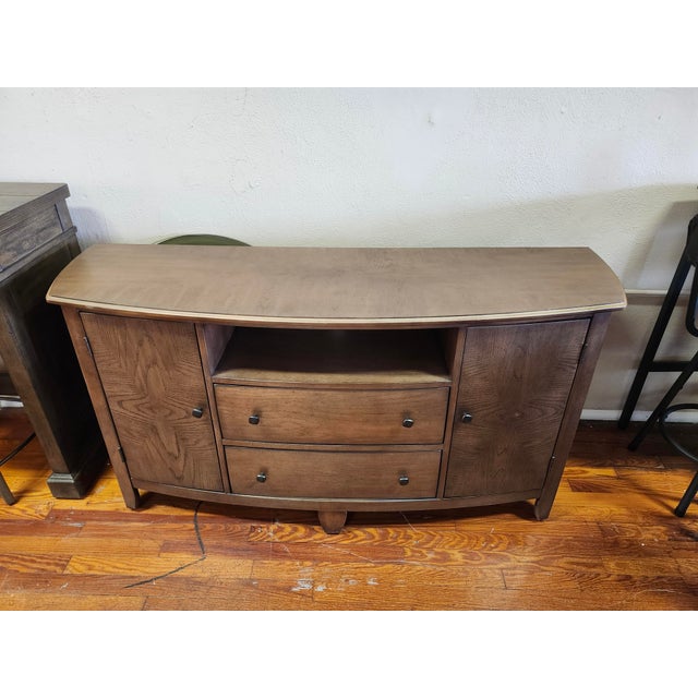 Add character, functionality, and timeless style to your living space with this beautiful Hammary Primo III Entertainment...