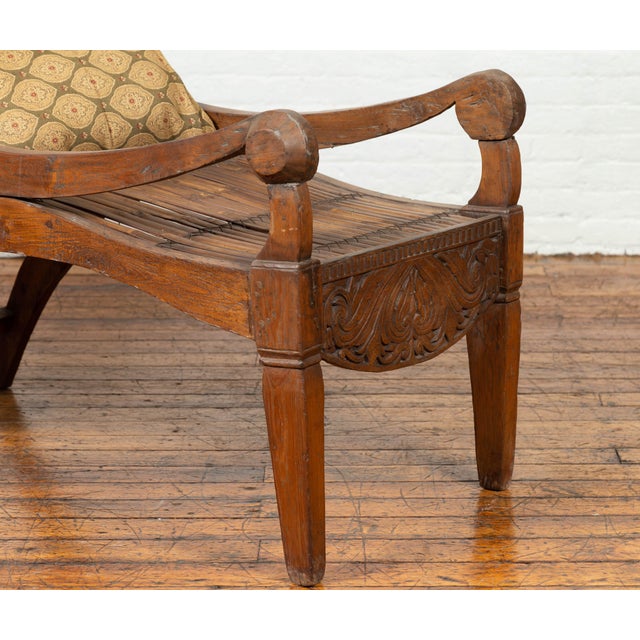 Early 20th Century Antique Indonesian Reclining Plantation Chair with Bamboo Slats and Carved Décor For Sale - Image 5 of 10