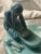 This vintage Van Briggle Pottery figurine depicts a Native American Indian girl grinding corn, showcasing a beautifully...