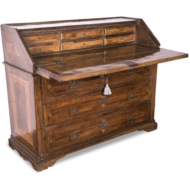 Antique 18th-century walnut Marche drop-leaf chest, featuring a front divided by three large drawers, six small drawers on...