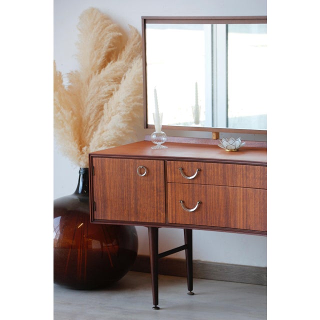 Mid-Century Vintage Teak Dressing Table (Attributed to Meredew) Be captivated by the timeless elegance of this stunning...