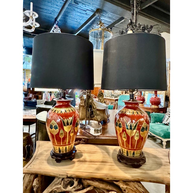 This is a show-stopper pair of Art Deco lamps. The brick-red porcelain vases have been finely decorated in Art Deco...
