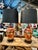 This is a show-stopper pair of Art Deco lamps. The brick-red porcelain vases have been finely decorated in Art Deco...