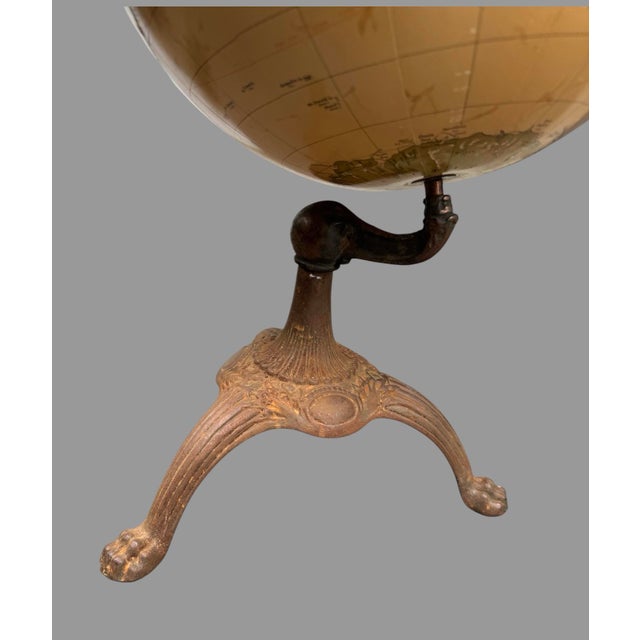 Cram's Imperial World Globe with Textured Mountain Ranges & Paw Footed Iron Base In very nice original condition showing...