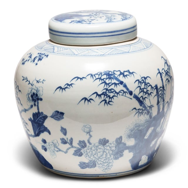 This round, porcelain ginger jar is brightly glazed in the blue-and-white manner. A combination of stenciled linework and...