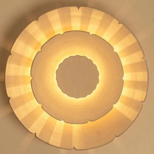 Spectacular circular ceramic wall light, with beautiful accents. Manufactured in denmark in the 1970s. In excellent...