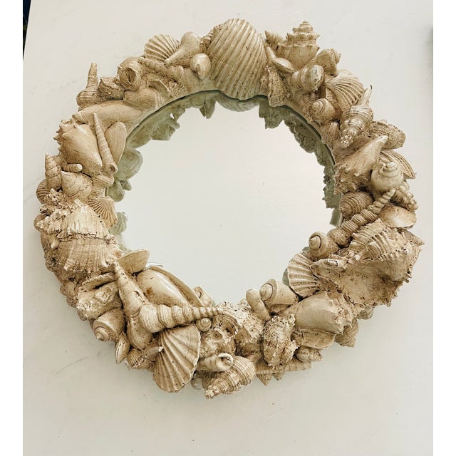 Impressive vintage Serge Roche shell plaster round mirror.