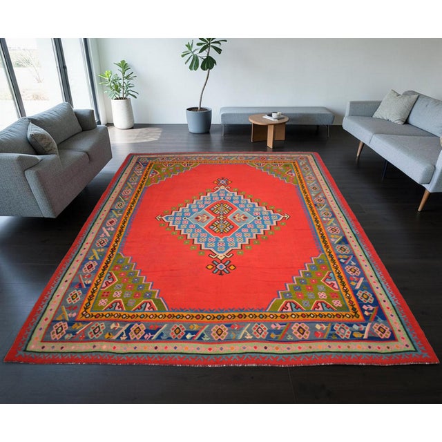 Woven in the Aegean region of Anatolia during the 1930s, this remarkable antique Oushak kilim is a genuine piece of...