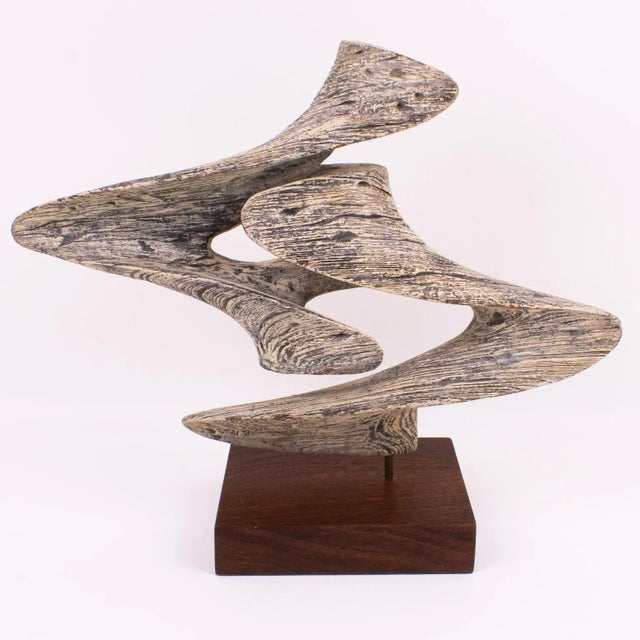 Elegant Mid-Century Modern 1970s wooden sculpture. Finely carved stylized free-form sculpture with bleached wood, with a...