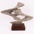 Elegant Mid-Century Modern 1970s wooden sculpture. Finely carved stylized free-form sculpture with bleached wood, with a...