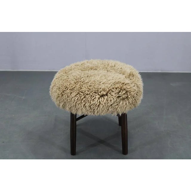 - Newly upholstered with quality sheep skin from Skandilock - wooden base has been refurbished