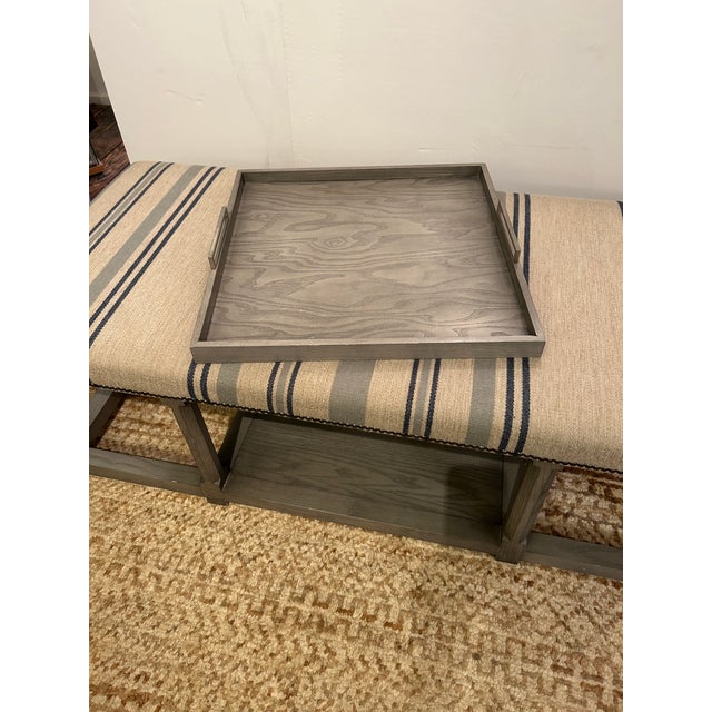 Stunning large rectangular bench having grey painted base and handsome striped upholstery with storage on lower tier and...