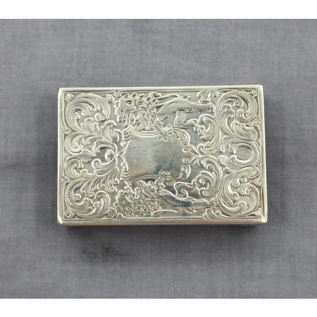 Sterling silver matchbox case, circa 1900, made for Tiffany by BAttin & Co. #226 in Baroque, embossed design with rampant...