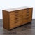 This Henredon 1960’s dresser features a classic mid-century modern design with clean lines and warm wood tones. It offers...
