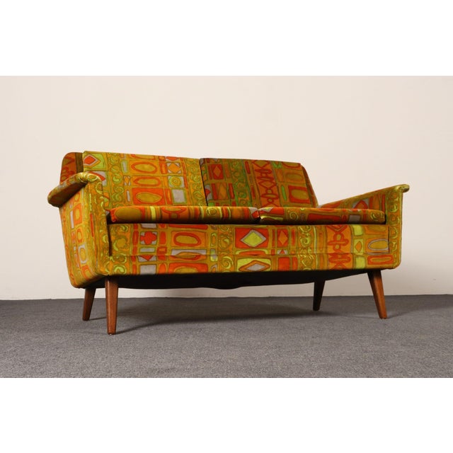 Scandinavian Modern settee by Swedish designer, Folke Ohlsson for Fritz Hansen upholstered in Jack Lenor Larsen "Caravan"...