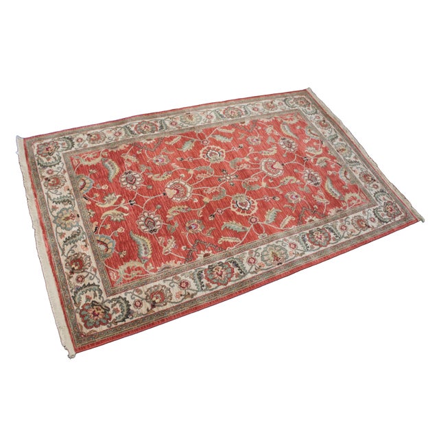 Vintage Karastan 100% wool area rug / mat / carpet featuring a floral motif inspired by palmettes and scrolled vines on a...