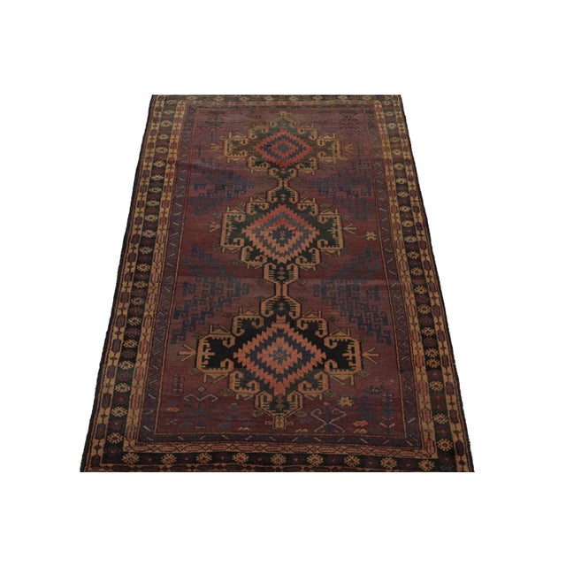 Hand knotted in wool, this 6x8 Baluch rug represents a new line of tribal carpets in the Modern Classics Collection by Rug...