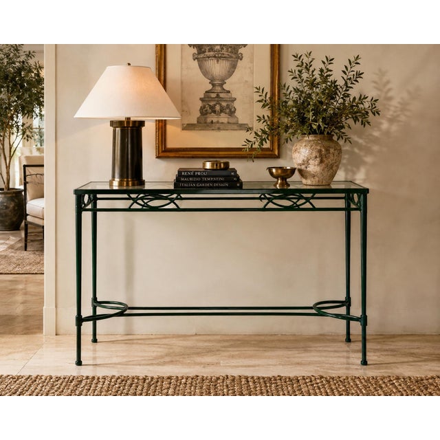 Elegant vintage iron and glass console table attributed to Mario Papperzini for Janus et Cie, distinguished by its...