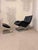 Robert Haussmann rocking chair with matching footstool from the 1980s, crafted from chrome and leather. This comfortable...