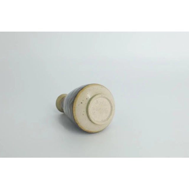 This miniature, collectible stoneware vase was designed by Gunnar Borg for the Swedish manufacture Höganäs Keramik during...