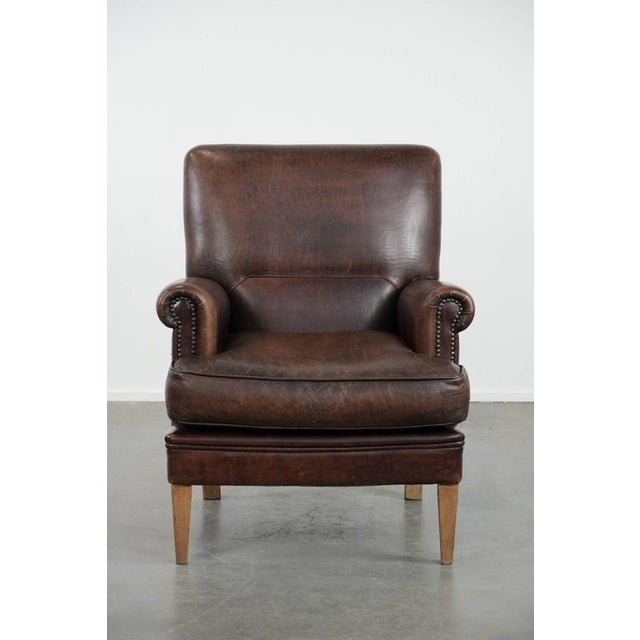 Characterful sheepskin armchair with a beautiful deep color. : This comfortable armchair is crafted from sheepskin and has...