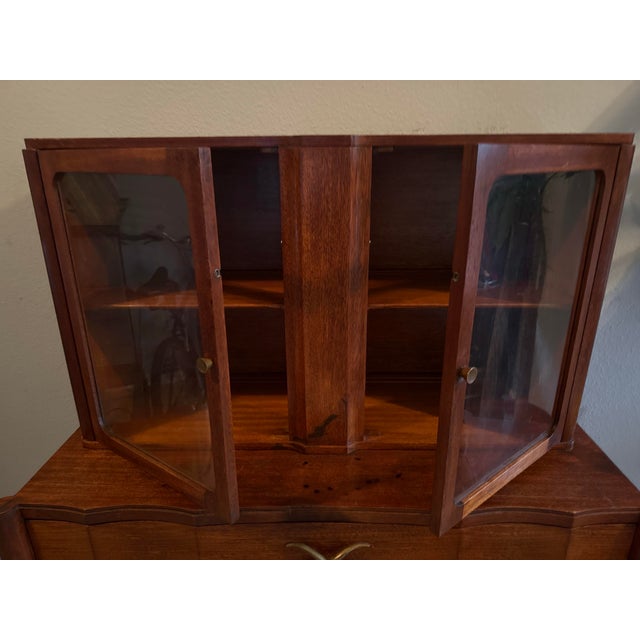 Authentic Mid-Century Modern two-piece hutch credenza manufactured by Brown-Saltman of South Gate, California. Designed in...