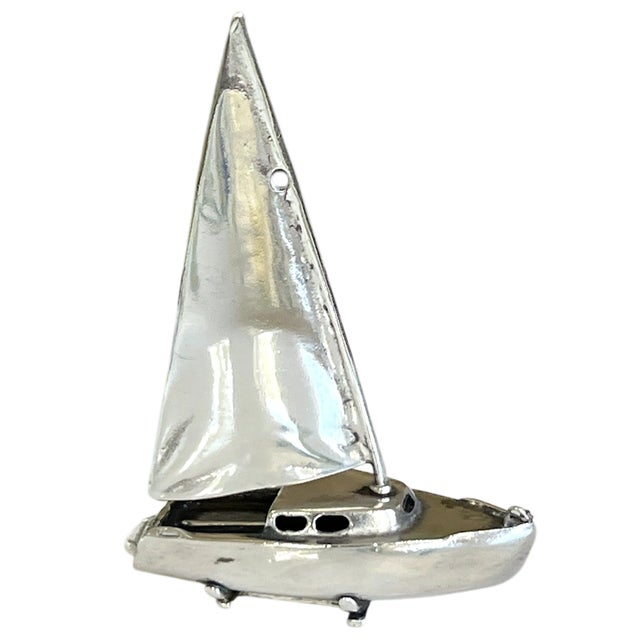 Charming miniature sailboat sculpture, crafted entirely from 34 grams of solid 925 sterling silver. Measuring...
