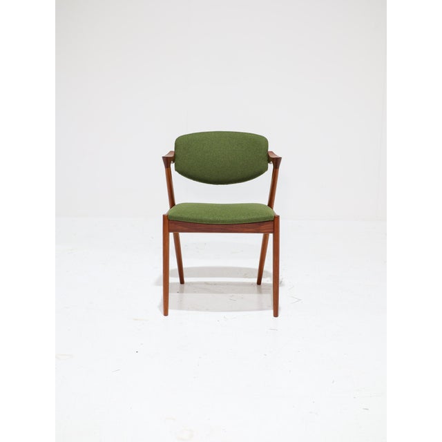 A set of six iconic model 42 dining chairs—also known as the "z-chair"—designed by kai kristiansen in denmark during the...