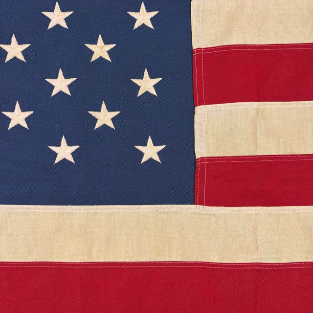 This vintage American flag is made from a cotton cloth with fully sewn stripes and 50 embroidered stars. Please note...