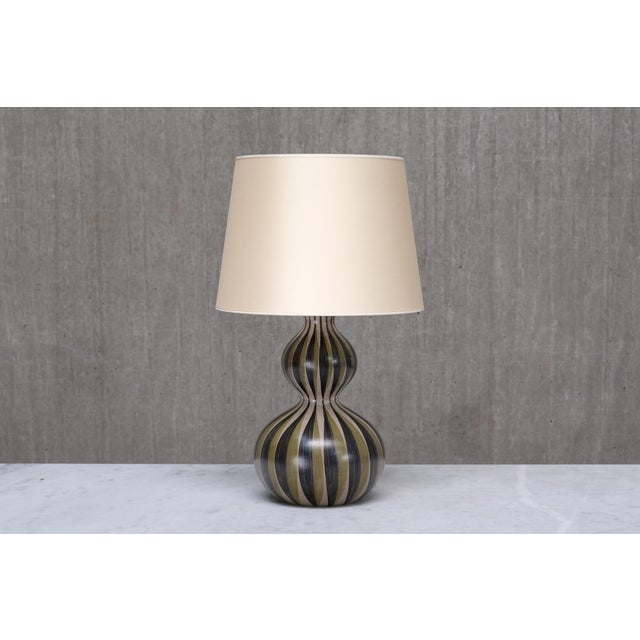 This extremely rare table lamp was designed by eva & johannes andersen and produced by their workshop e&j keramik in...