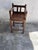 A striking Brutalist children’s chair crafted from solid oak, distinguished by its bold architectural lines and robust...