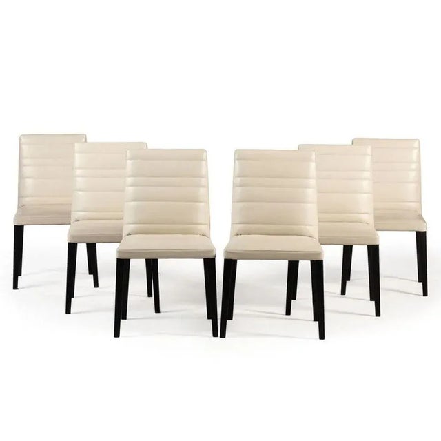 Vintage set of six "Louise" cream/putty chairs feature a sturdy structure made from solid ash and beech wood. The seats...