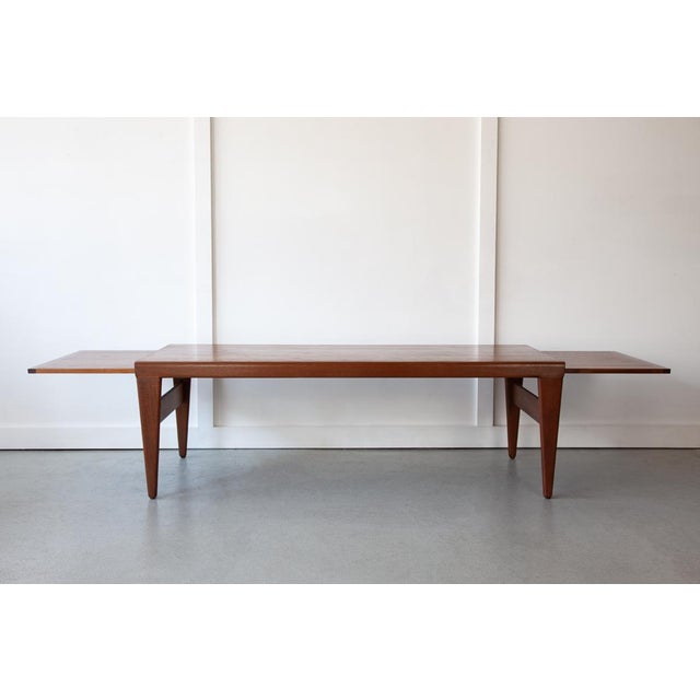 A beautiful coffee table designed by Illum Wikkelsø for Koefoeds Mobelfabrik with inbuilt extending leaves. This piece is...