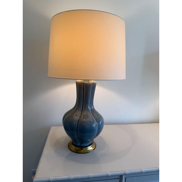 Pretty slate blue lamps with brass base and ball finial. Excellent condition. Shades included 32”H x 11”H base: 8”W shade:...