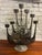 Large Brutalist Brazed Metal Candelabra signed by Gene Byron, Mexico, 1960s. Measures 16 X 23 1/2″h. and has a dark, warm...