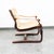 Tan sling lounge chair with saddle leather arms. Unsigned example. This piece was recently imported directly from Denmark.