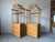 Beautiful vintage coastal-style etagères crafted in natural rattan and bamboo, featuring elegant pagoda-inspired crest...