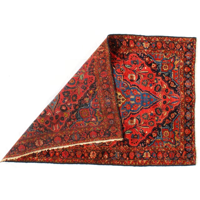 A hand-knotted antique Sarouk Farahan rug. The piece was made from hand-spun lamb's wool and all natural dyes. Circa 1880.