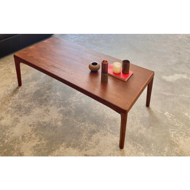 Henning Kjærnulf for Vejle Mobelfabrik (stamped to underside). Solid teak coffee table with subtle and nuanced details....