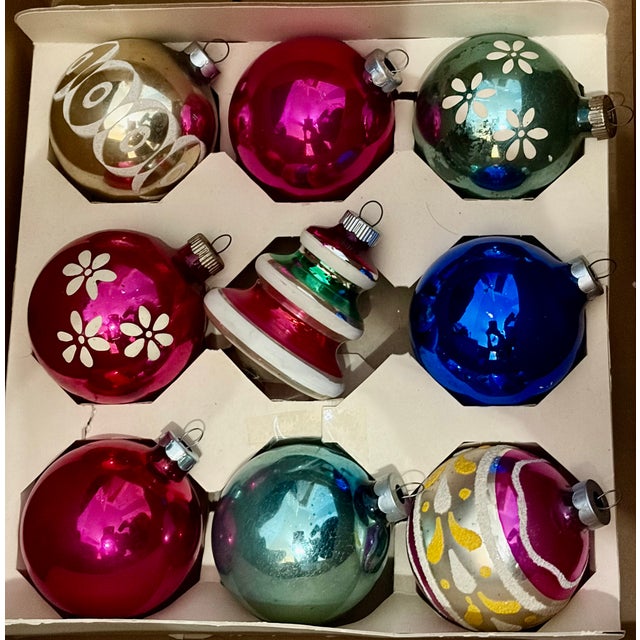 Nine (9) fabulous vintage Shiny Brite mercery glass ornaments. Made between sometime in the 1950s, this assortment...