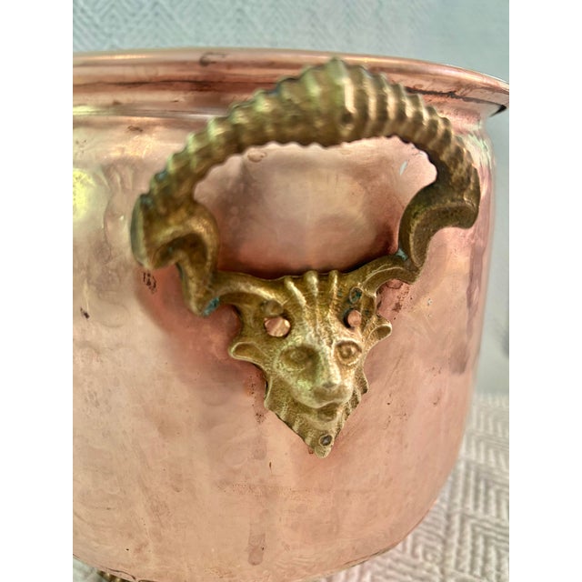 Metal Early 20th Century Hammered Copper Jardinere With Brass Rams Head Handles and Lion Paw Feet For Sale - Image 7 of 10