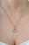 This charming clover-inspired pendant features 1.01 carats of natural multi sapphire, set in 14k yellow gold. Each...