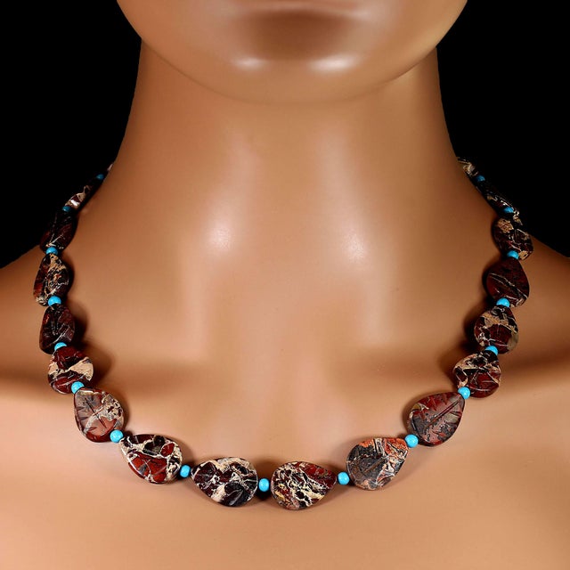 This 20‑inch necklace becomes a standout piece thanks to its **unique carved picture jasper leaves**, each one naturally...