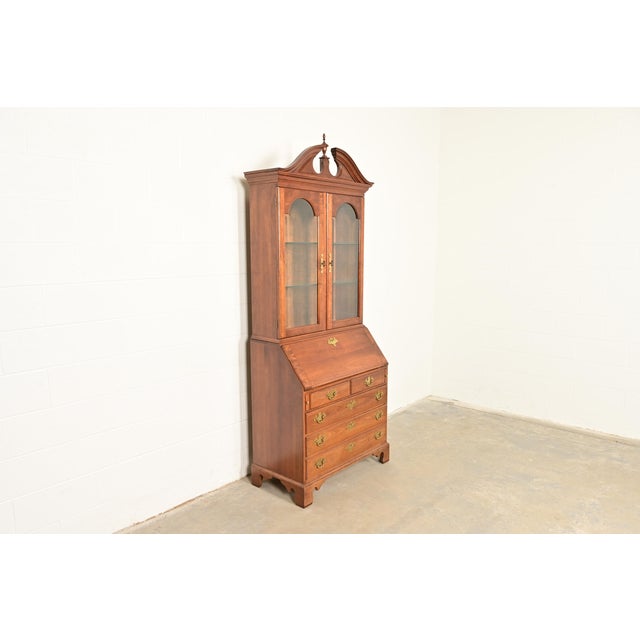 A beautiful Georgian or Chippendale style bureau with drop front secretary desk and bookcase hutch top By L. & J.G....