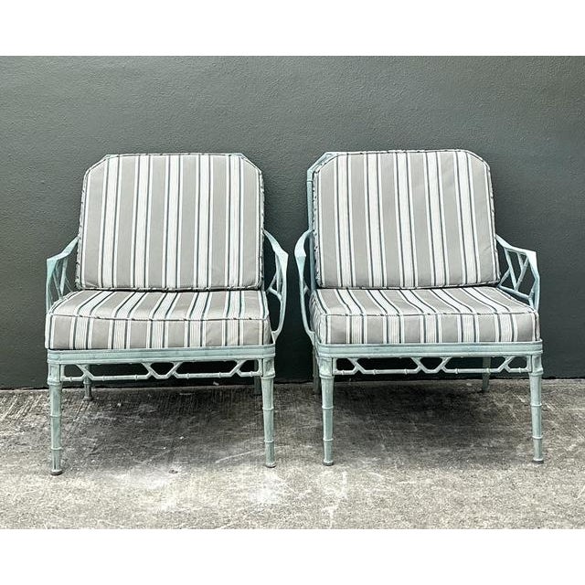 This exceptional pair of vintage lounge chairs embodies the sophisticated allure of Palm Beach Regency design. Crafted in...