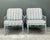 This exceptional pair of vintage lounge chairs embodies the sophisticated allure of Palm Beach Regency design. Crafted in...