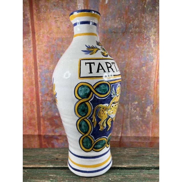 This old pharmacy jar or albarello in the shape of a bottle possesses fascinating features that make it a captivating...