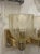The product is a pair of Murano gold glass cup sconces, which are decorative lighting fixtures that can add a touch of...