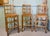 A trio of early 20th century oak lattice back dining chairs, probably by Heals, the chairs are in Golden Oak. They have...